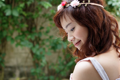 Close-up of young woman standing outdoors