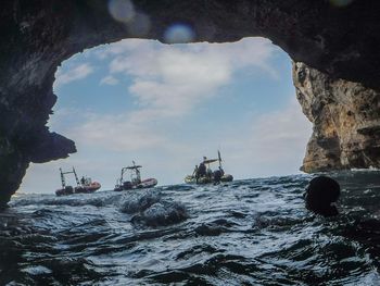 High angle view of people on sea against sky