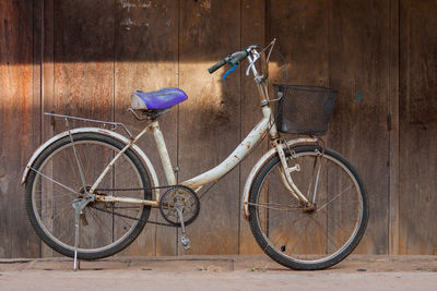 Bicycle leaning against wall