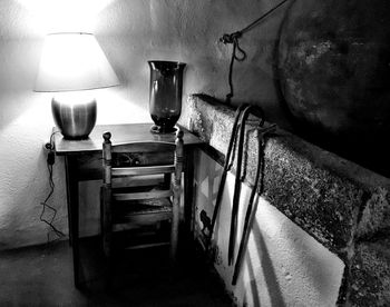 Table by illuminated lamp at home