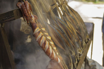 Skewers of squid and fish cooked over an open fire, affordable meal in tulungagung, indonesia