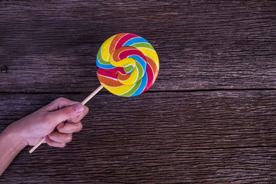 Human hand holding ice cream cone