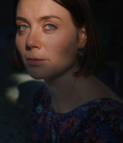 Close-up portrait of young woman looking away