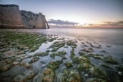 Scenic view of sea against sky at sunset