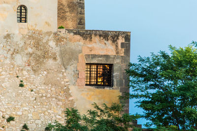 Low angle view of old building against sky