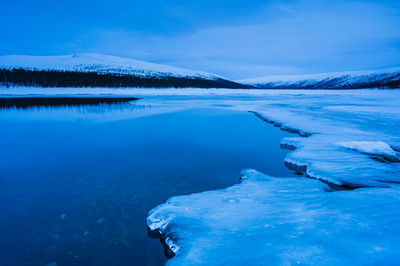 Ice in front of still lake