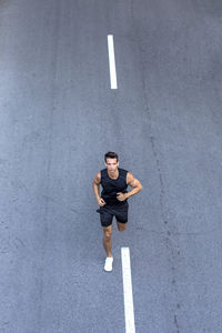 High angle view of man running on road