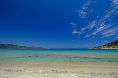 View of beach against blue sky