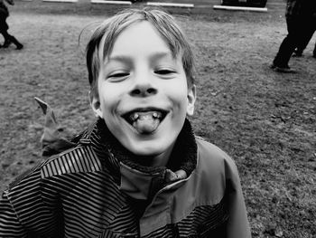 Portrait of boy on field