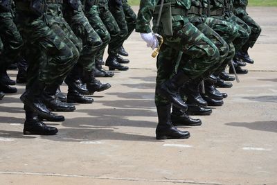 Low section of soldiers standing on street