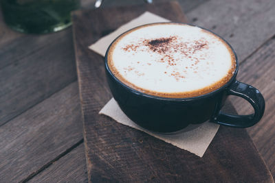 High angle view of coffee cup on table