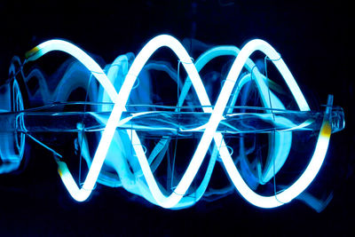 Close-up of light painting against black background