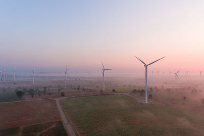Scenic view of field against sky during sunset