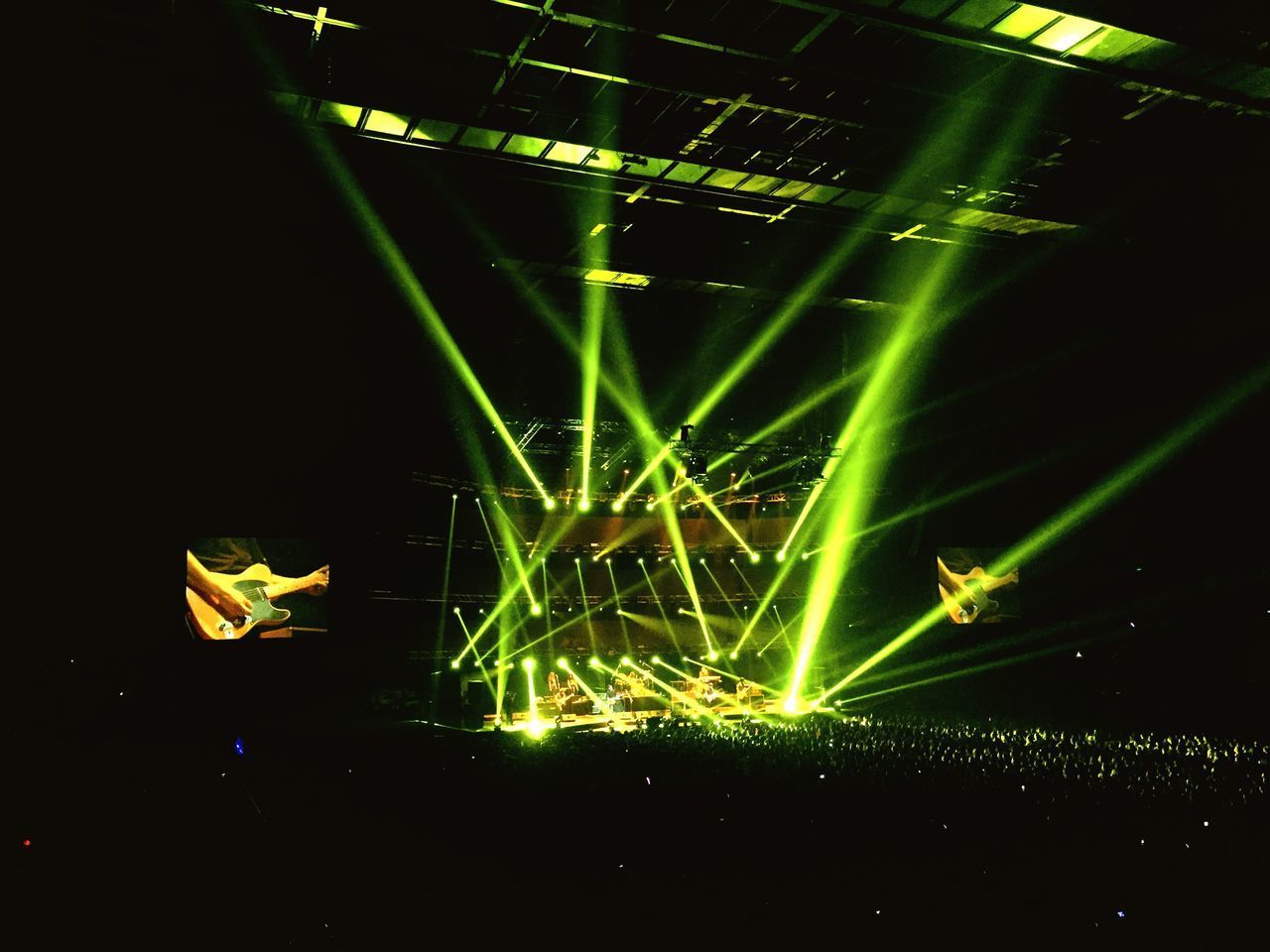 CLOSE-UP OF ILLUMINATED STAGE AT NIGHT