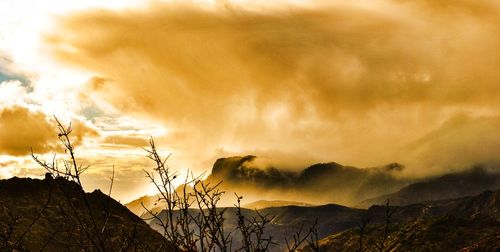 Scenic view of dramatic sky during sunset