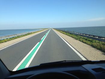 View of road through car windshield