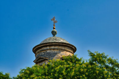 Low angle view of traditional building against clear blue sky