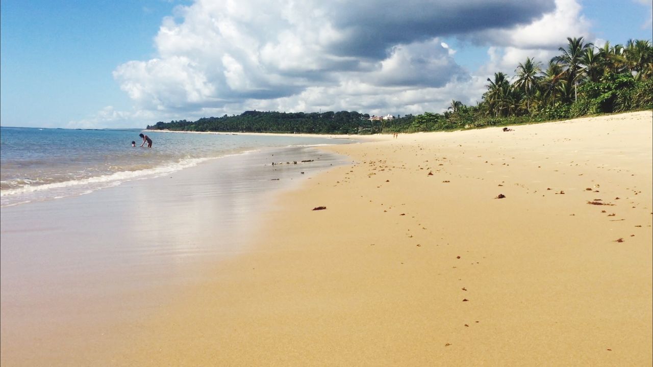 beach, sea, sky, cloud - sky, outdoors, sand, beauty in nature, nature, scenics, tree, water, horizon over water, day, people, one person