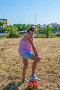 Full length of girl on field