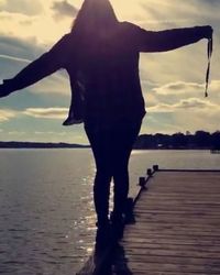 Silhouette of woman in water