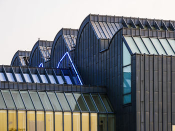 Low angle view of modern building against clear sky