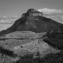 Scenic view of mountain against cloudy sky