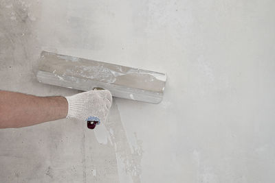 Man working on wall at home