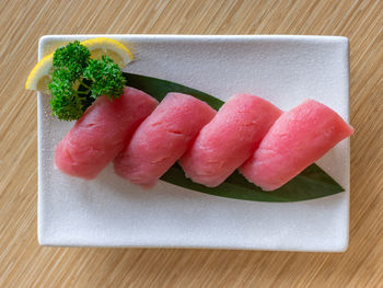 High angle view of sushi on cutting board