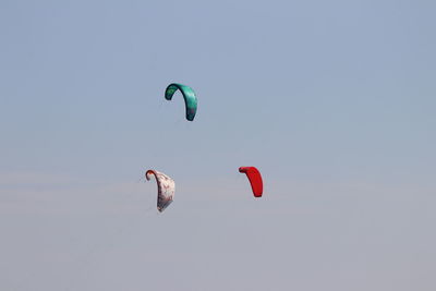 Low angle view of kite flying against clear sky