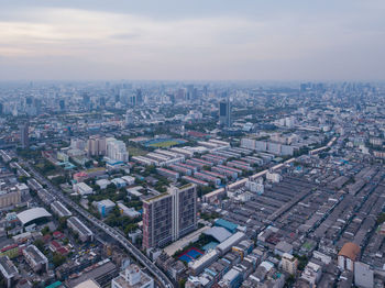 High angle view of buildings in city against sky