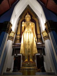 Low angle view of statue against building