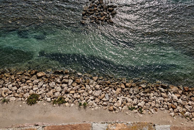High angle view of stones on beach