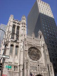 Low angle view of buildings against sky in city