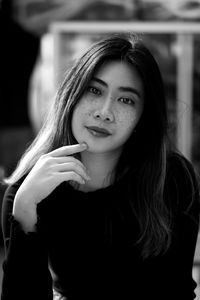 Portrait of young woman looking away