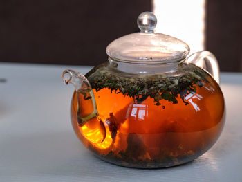 Close-up of tea in glass on table.