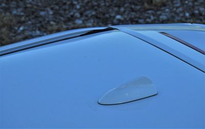 Close-up of reflection of car on glass