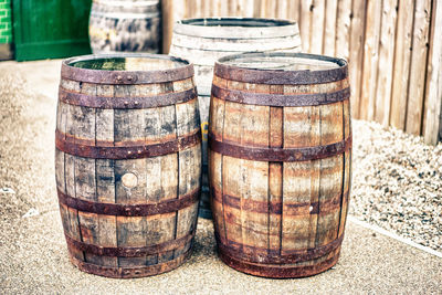 Close-up of wine bottles on wooden table