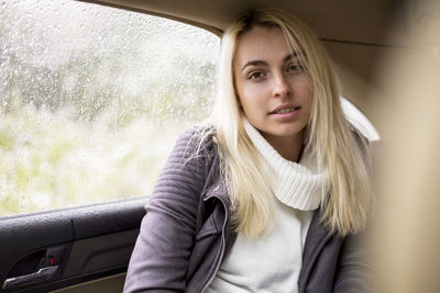 Portrait of beautiful woman in car