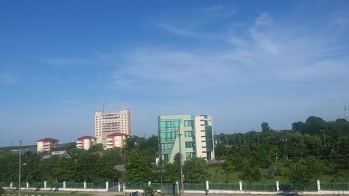 City buildings against blue sky