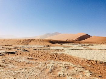 Scenic view of desert against clear sky