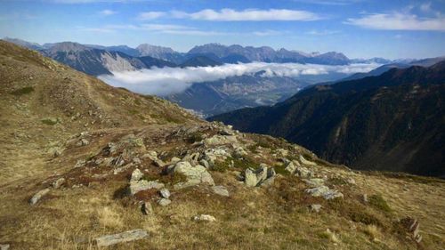 Scenic view of landscape and mountains against sky