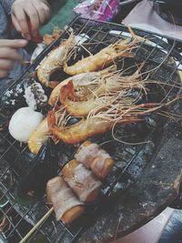 High angle view of meat on barbecue grill