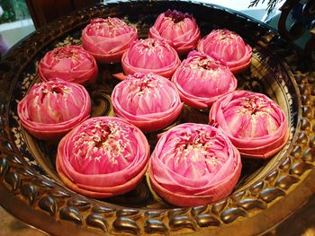 High angle view of pink roses in basket