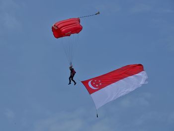 Low angle view of kite flying against sky