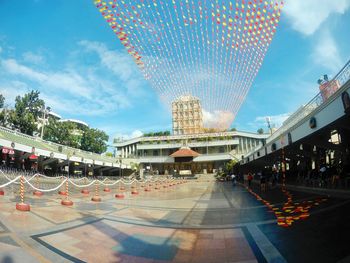 Panoramic view of people in city against sky