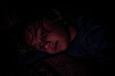 Portrait of boy sleeping in bed