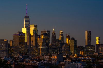 Illuminated skyscrapers in city