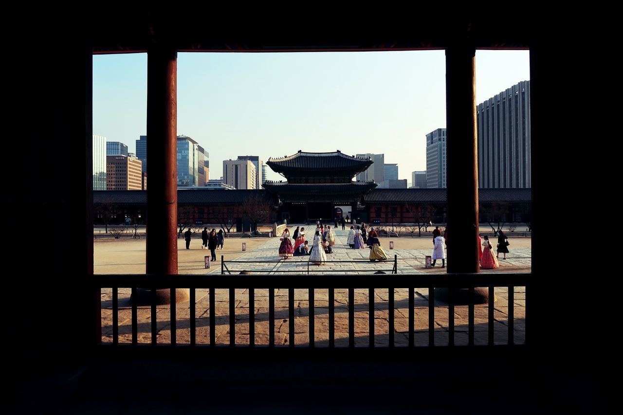 GROUP OF PEOPLE IN CITY BUILDING