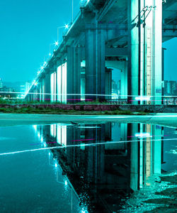 Reflection of illuminated building in water