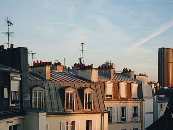 Buildings in city against sky